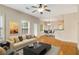 Cozy living room with hardwood floors, neutral decor, and a connected dining area at 650 Virginia Highlands, Fayetteville, GA 30215
