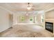This light and airy main bedroom features a fireplace and tray ceiling at 650 Virginia Highlands, Fayetteville, GA 30215