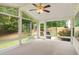 Bright sunroom with multiple windows offering views of the landscaped backyard at 650 Virginia Highlands, Fayetteville, GA 30215