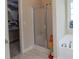 Bathroom featuring a shower, soaking tub, and a closet with ample space for storage at 152 Cooper Creek Dr, Dallas, GA 30157