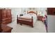 Charming bedroom featuring a wood bed frame, carpet and a large window providing natural light at 152 Cooper Creek Dr, Dallas, GA 30157
