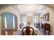 Bright dining room with a large window, chandelier, and classic furnishings at 152 Cooper Creek Dr, Dallas, GA 30157