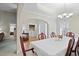 Dining room with elegant chandelier and easy access to laundry and living areas at 152 Cooper Creek Dr, Dallas, GA 30157