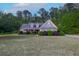 Charming single-Gathering home with manicured lawn and mature landscaping, perfect for outdoor enjoyment at 152 Cooper Creek Dr, Dallas, GA 30157