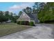 Well-maintained home showcasing a spacious driveway and lush landscaping, offering curb appeal at 152 Cooper Creek Dr, Dallas, GA 30157