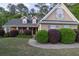 Lovely home with well-manicured landscaping, sidewalk, and a welcoming front entrance at 152 Cooper Creek Dr, Dallas, GA 30157