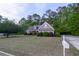 Charming single-Gathering home featuring a meticulously landscaped front yard and a welcoming entrance at 152 Cooper Creek Dr, Dallas, GA 30157