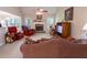 Spacious living room features a cozy fireplace, vaulted ceiling, and abundant natural light at 152 Cooper Creek Dr, Dallas, GA 30157