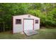 Exterior of storage shed with red trim, and a ramp at 152 Cooper Creek Dr, Dallas, GA 30157