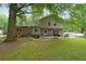 Backyard with a patio area and lush green lawn perfect for outdoor entertaining at 387 Cascade Sw Dr, Lilburn, GA 30047