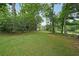 Lush backyard offering privacy and tranquility, backing to conservation land at 387 Cascade Sw Dr, Lilburn, GA 30047