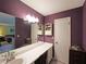Bathroom with a long vanity and an adjoining room with the bedroom visible at 387 Cascade Sw Dr, Lilburn, GA 30047