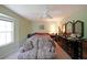 Relaxing bedroom featuring a ceiling fan, and ample closet space for storage at 387 Cascade Sw Dr, Lilburn, GA 30047