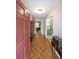 Inviting entryway with hardwood floors, light pink walls, and a view into other rooms at 387 Cascade Sw Dr, Lilburn, GA 30047