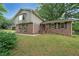 Charming brick home with a well-manicured lawn and lovely curb appeal at 387 Cascade Sw Dr, Lilburn, GA 30047