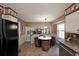 Eat-in kitchen with a barrel dining set and neutral colors at 387 Cascade Sw Dr, Lilburn, GA 30047