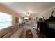 Comfortable living room featuring a ceiling fan and access to the kitchen at 387 Cascade Sw Dr, Lilburn, GA 30047