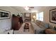 The cozy living room has a brick fireplace, built-in shelves, and comfortable seating, perfect for Gathering time at 387 Cascade Sw Dr, Lilburn, GA 30047