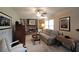 The inviting living room features a brick fireplace, built-in shelves, and comfortable seating arrangements at 387 Cascade Sw Dr, Lilburn, GA 30047