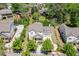 A well-kept home sits among mature landscaping and offers a charming curb appeal in a suburban setting at 500 S Hill St, Buford, GA 30518