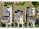 An aerial view displays a property with manicured lawns and a practical driveway layout within a residential area at 500 S Hill St, Buford, GA 30518