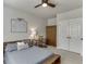 Comfortable bedroom with a ceiling fan, closet, wooden desk and wardrobe at 500 S Hill St, Buford, GA 30518