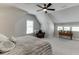Spacious bedroom featuring a ceiling fan, neutral colors, and plenty of natural light at 500 S Hill St, Buford, GA 30518