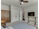 Bedroom with a ceiling fan, closet, wardrobe, and desk at 500 S Hill St, Buford, GA 30518