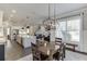 Open concept layout with dining area, kitchen, and living room for seamless entertaining at 500 S Hill St, Buford, GA 30518
