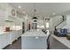 Well-lit open kitchen and living area featuring a large island and seamless design at 500 S Hill St, Buford, GA 30518