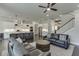 Open floor plan with a view of a modern kitchen and cozy living area with leather sofas at 500 S Hill St, Buford, GA 30518