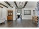 Elegant living room with dark hardwood floors, exposed beams, and stylish decor, creating a warm and inviting ambiance at 500 S Hill St, Buford, GA 30518