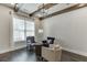 Stylish sitting area with hardwood floors, beamed ceilings, neutral walls, and a large window for natural light at 500 S Hill St, Buford, GA 30518
