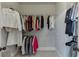 Walk-in closet equipped with ample storage and organizational solutions for clothing at 500 S Hill St, Buford, GA 30518