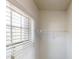 Walk-in closet with a double window and shelving for storing clothes and accessories at 881 Upland Ives Dr, Sugar Hill, GA 30518