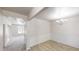 Bright dining room features elegant wainscoting, wood floors, a modern chandelier, and adjacent living space at 881 Upland Ives Dr, Sugar Hill, GA 30518