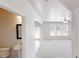 Inviting foyer leading to a powder room, staircase and spacious living area with natural light at 881 Upland Ives Dr, Sugar Hill, GA 30518