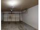 Empty 2 car garage with a standard garage door at 881 Upland Ives Dr, Sugar Hill, GA 30518