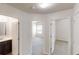 Bright hallway featuring views of a bathroom and a bedroom at 881 Upland Ives Dr, Sugar Hill, GA 30518