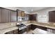 A well-equipped kitchen with stainless steel appliances and granite countertops at 881 Upland Ives Dr, Sugar Hill, GA 30518