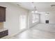 Bright, open living area with fireplace, ceiling fan, and direct access to the outdoors at 881 Upland Ives Dr, Sugar Hill, GA 30518