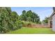 Spacious backyard featuring a lush lawn, privacy fence, and mature trees at 1062 Grant Ter Se, Atlanta, GA 30315