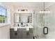 Modern bathroom with double vanity, quartz countertops, and a glass-enclosed shower at 1062 Grant Ter Se, Atlanta, GA 30315