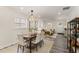 Open-concept living and dining area features modern lighting and a comfortable seating arrangement at 1062 Grant Ter Se, Atlanta, GA 30315