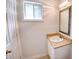 A quaint bathroom with a window and vanity provides essential amenities at 1151 Rankin St # 2C, Stone Mountain, GA 30083