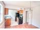 Kitchen with stainless steel appliances, and a dining area with a modern chandelier at 1151 Rankin St # 2C, Stone Mountain, GA 30083