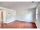Spacious living room with wood floors and freshly painted walls at 1151 Rankin St # 2C, Stone Mountain, GA 30083