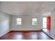 Bright living room with wood floors, fresh paint, and abundant natural light at 1151 Rankin St # 2C, Stone Mountain, GA 30083