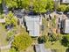Aerial view showcases a home, a metal outbuilding, and surrounding landscaping at 2909 Jones Mill Rd, Atlanta, GA 30360