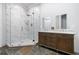Modern bathroom with a double vanity, granite countertops, a walk-in shower, and beautiful tile floors at 2909 Jones Mill Rd, Atlanta, GA 30360
